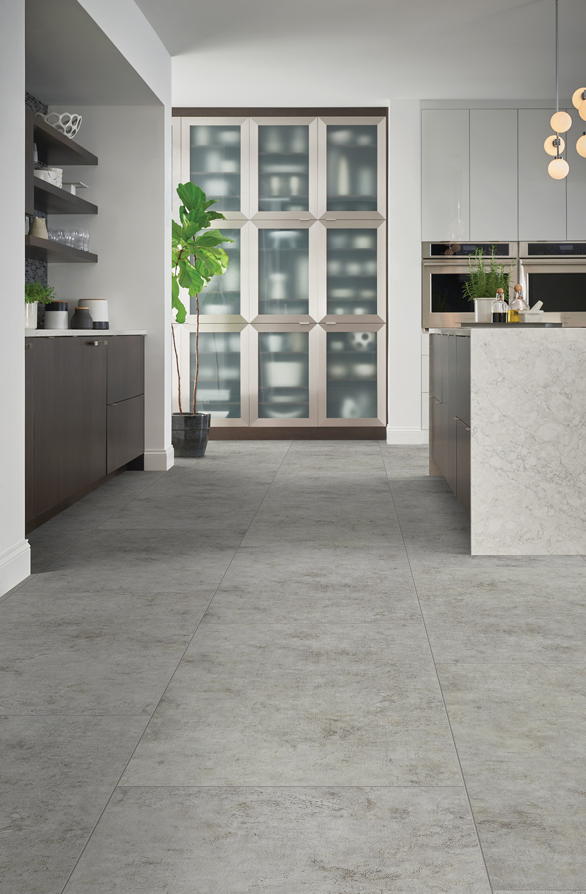Light colored luxury vinyl tile in light colored kitchen with an island